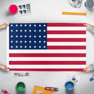A mockup of the custom flag '50 Star American Flag but in style of the 40 star flag' held up on a table during print checking