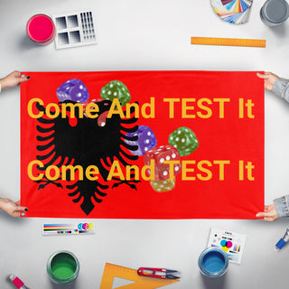 A mockup of the custom flag 'T flag' held up on a table during print checking