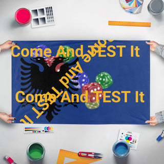 A mockup of the custom flag 'T flag' held up on a table during print checking