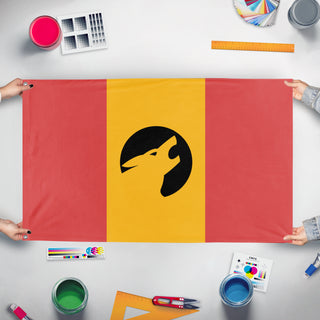 A mockup of the custom flag 'kaimuu flag' held up on a table during print checking