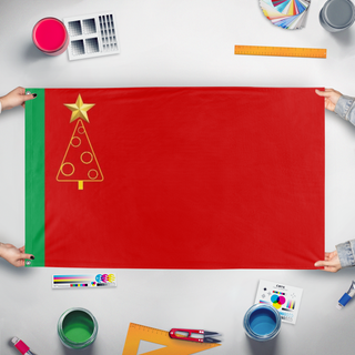 A mockup of the custom flag 'Communist Christmas f flag' held up on a table during print checking