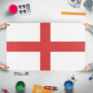 A mockup of the custom flag 'testing flag' held up on a table during print checking