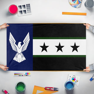 A mockup of the custom flag 'Aspin flag' held up on a table during print checking