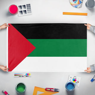 A mockup of the custom flag 'Pan Arab flag' held up on a table during print checking