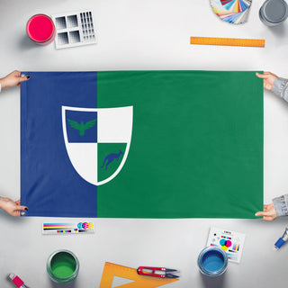 A mockup of the custom flag 'Kingdom Of Merovia flag' held up on a table during print checking