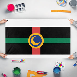 A mockup of the custom flag 'Kaleido-SPACE flag' held up on a table during print checking