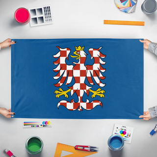 A mockup of the custom flag 'moravia_boa_2 flag' held up on a table during print checking