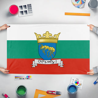 A mockup of the custom flag 'Flag of Bulgaria and UCCM' held up on a table during print checking