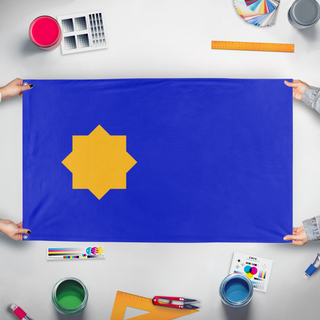 A mockup of the custom flag 'Flag of the Kingdom of Betelgeuse' held up on a table during print checking