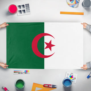 A mockup of the custom flag 'Flag of Algeria' held up on a table during print checking