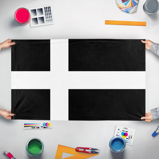 A mockup of the custom flag 'LStndrd flag' held up on a table during print checking