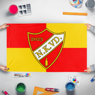 A mockup of the custom flag 'NKVS_SPORTS flag' held up on a table during print checking