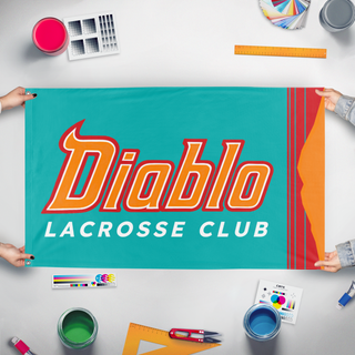 A mockup of the custom flag 'DIABLO-LAX flag' held up on a table during print checking