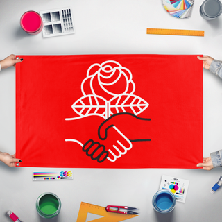 A mockup of the custom flag 'DSA flag' held up on a table during print checking