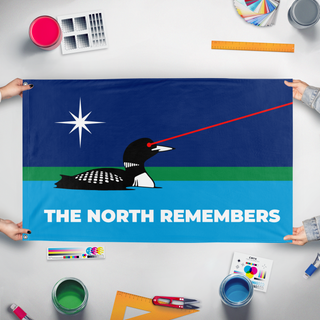 A mockup of the custom flag 'Minnesota Laser Loon flag' held up on a table during print checking