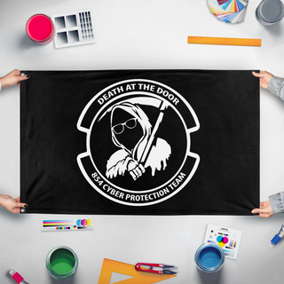 A mockup of the custom flag '854 CPT flag' held up on a table during print checking