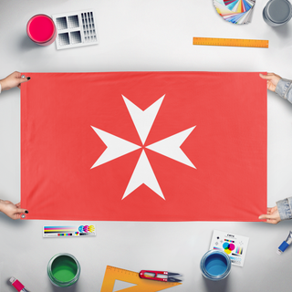 A mockup of the custom flag 'Maltese Cross flag' held up on a table during print checking