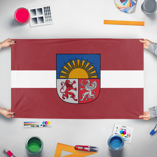 A mockup of the custom flag 'Latvian Coat of Arms flag' held up on a table during print checking