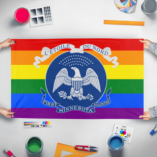 A mockup of the custom flag 'Modern First Minnesota Volunteers Pride flag' held up on a table during print checking