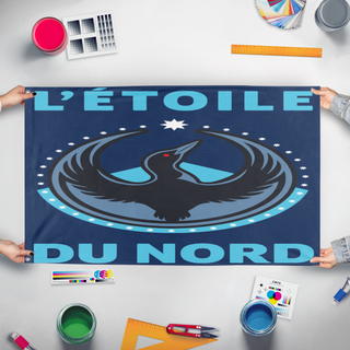 A mockup of the custom flag 'L'etoile Du Nord flag' held up on a table during print checking