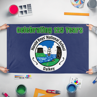 A mockup of the custom flag 'Harold Boys National School flag' held up on a table during print checking