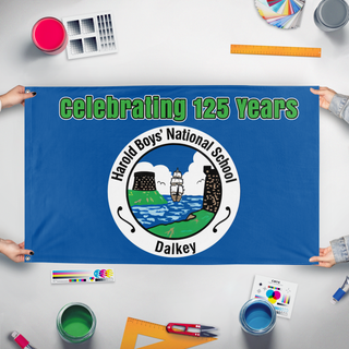 A mockup of the custom flag 'Harold Boys National School flag' held up on a table during print checking