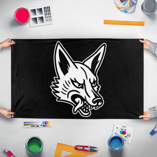 A mockup of the custom flag 'Jackal flag' held up on a table during print checking