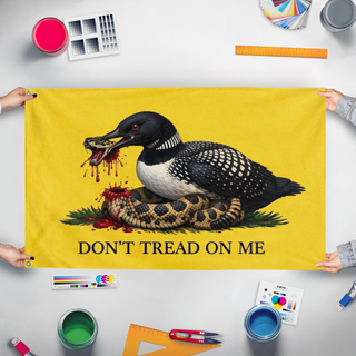 A mockup of the custom flag 'Don'tTreadLoon flag' held up on a table during print checking