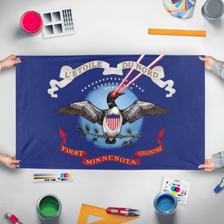 A mockup of the custom flag 'First Minnesota Volunteers Laser Loon flag' held up on a table during print checking