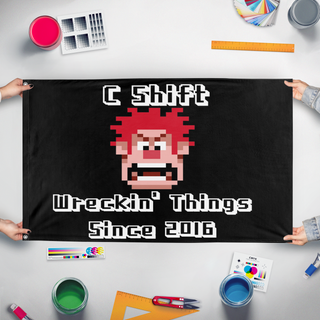 A mockup of the custom flag 'C Shift flag' held up on a table during print checking