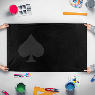 A mockup of the custom flag 'Spade flag' held up on a table during print checking