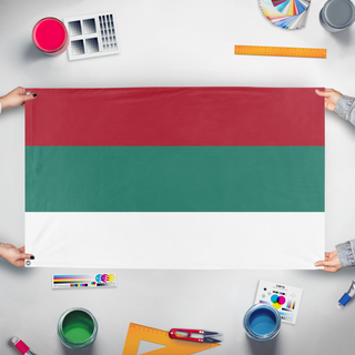 A mockup of the custom flag 'valudia flag' held up on a table during print checking