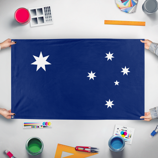 A mockup of the custom flag 'Australian Proposal flag' held up on a table during print checking