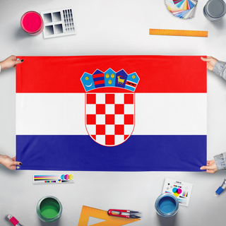 A mockup of the custom flag 'HRVATSKA flag' held up on a table during print checking