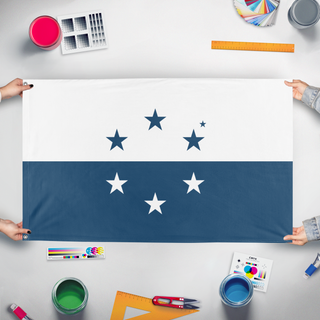 A mockup of the custom flag 'Osea flag' held up on a table during print checking
