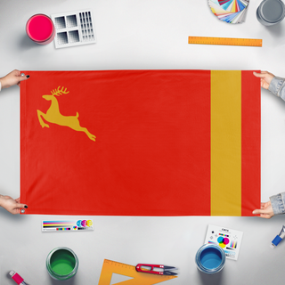 A mockup of the custom flag 'Yuktobania flag' held up on a table during print checking