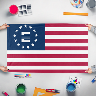A mockup of the custom flag 'Enclave States of America flag' held up on a table during print checking