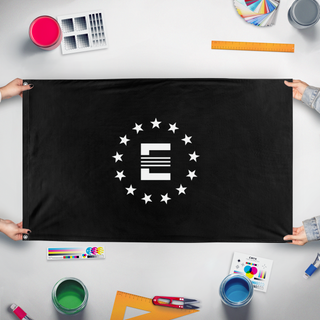 A mockup of the custom flag 'Enclave flag' held up on a table during print checking