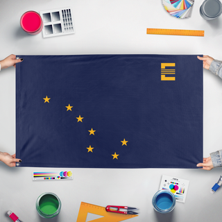 A mockup of the custom flag 'Alaskan Enclave flag' held up on a table during print checking