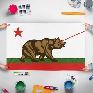 A mockup of the custom flag 'California Laser Bear flag' held up on a table during print checking
