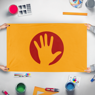 A mockup of the custom flag 'Flag of Humanity' held up on a table during print checking