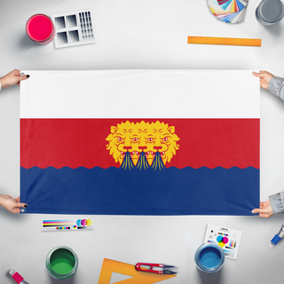 A mockup of the custom flag 'tri-lion flag' held up on a table during print checking