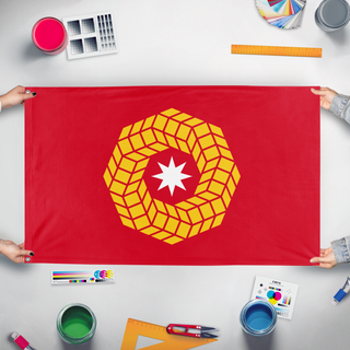 A mockup of the custom flag 'hexawheel flag' held up on a table during print checking