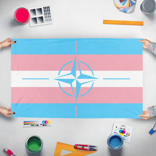 A mockup of the custom flag 'trans nato flag' held up on a table during print checking