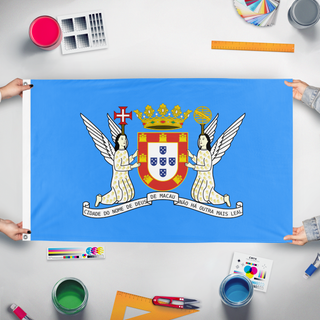 A mockup of the custom flag 'Portuguese Macau flag' held up on a table during print checking