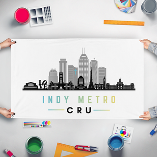 A mockup of the custom flag 'Indy Metro Cru flag' held up on a table during print checking