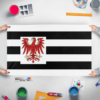 A mockup of the custom flag 'Flag of Brandenburg' held up on a table during print checking