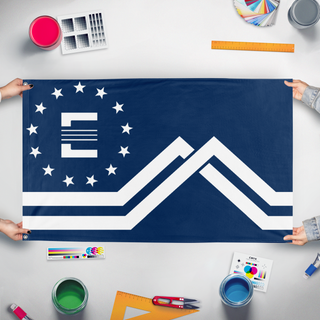 A mockup of the custom flag 'Montana Enclave flag' held up on a table during print checking
