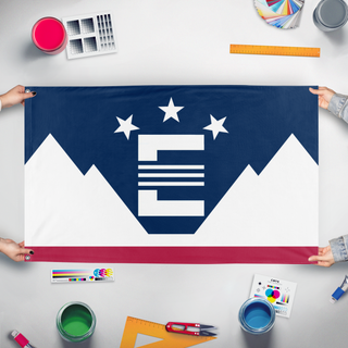 A mockup of the custom flag 'The Northern Territories' held up on a table during print checking