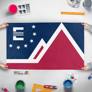 A mockup of the custom flag 'The Northern Mandate' held up on a table during print checking